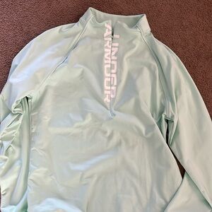 Woman’s Under Armour Pullover. XL. Never worn.